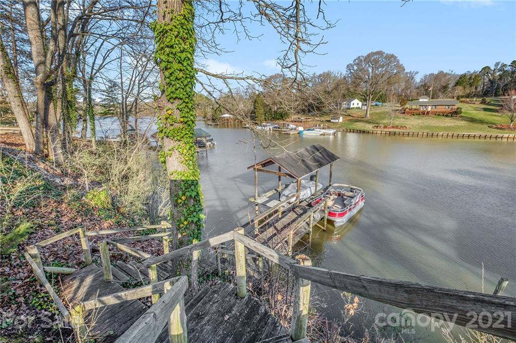 13914 Point Lookout Road Charlotte, NC 28278 - Photo 1 of 41 a view of a house with pool and lake view