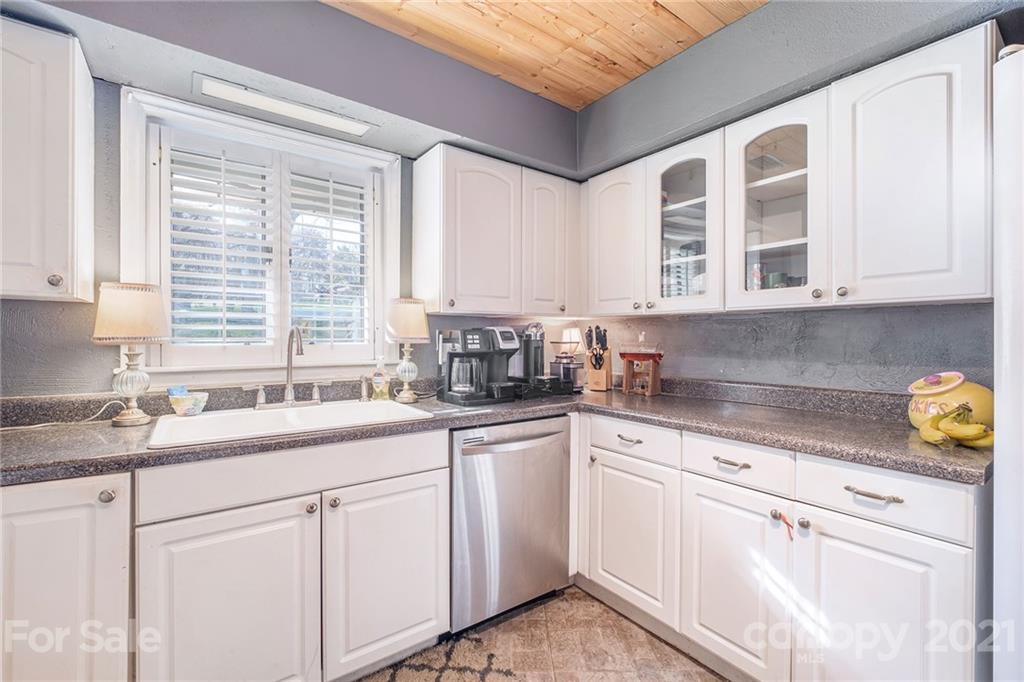 13914 Point Lookout Road Charlotte, NC 28278 - Photo 11 of 41 a kitchen with stainless steel appliances granite countertop white cabinets and window