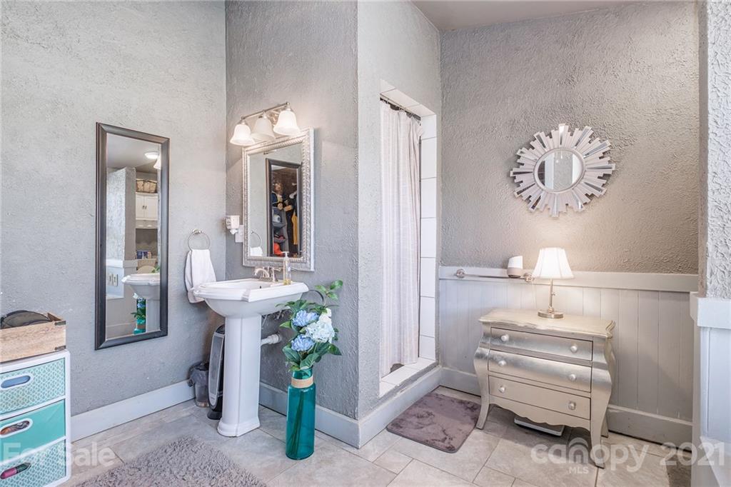 13914 Point Lookout Road Charlotte, NC 28278 - Photo 18 of 41 a bathroom with a sink and a mirror