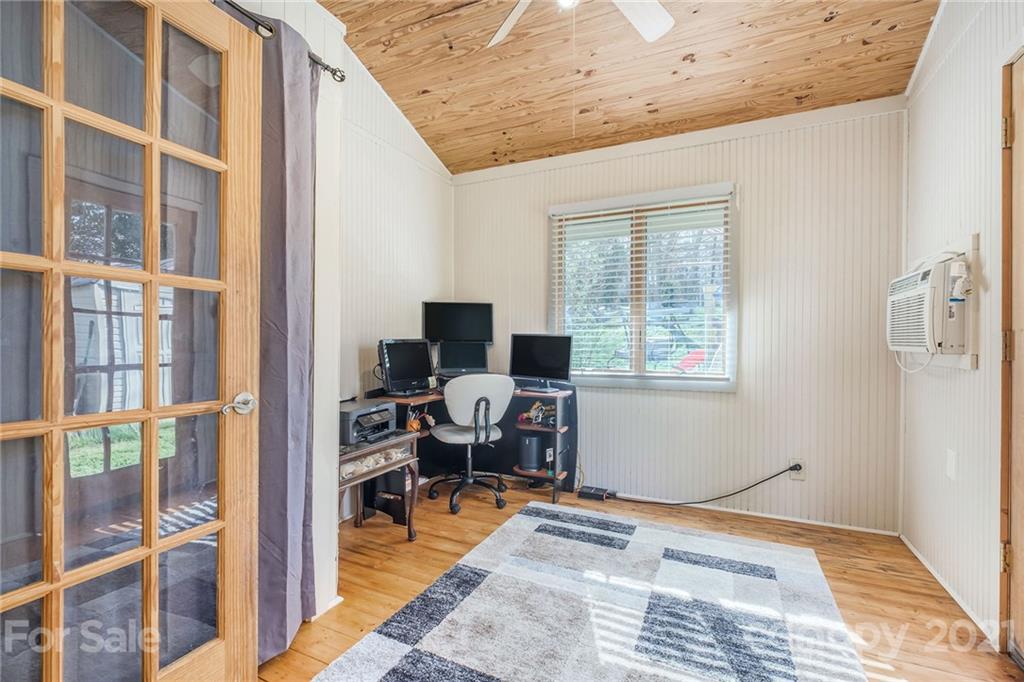 13914 Point Lookout Road Charlotte, NC 28278 - Photo 20 of 41 a view of a workspace with furniture and a window