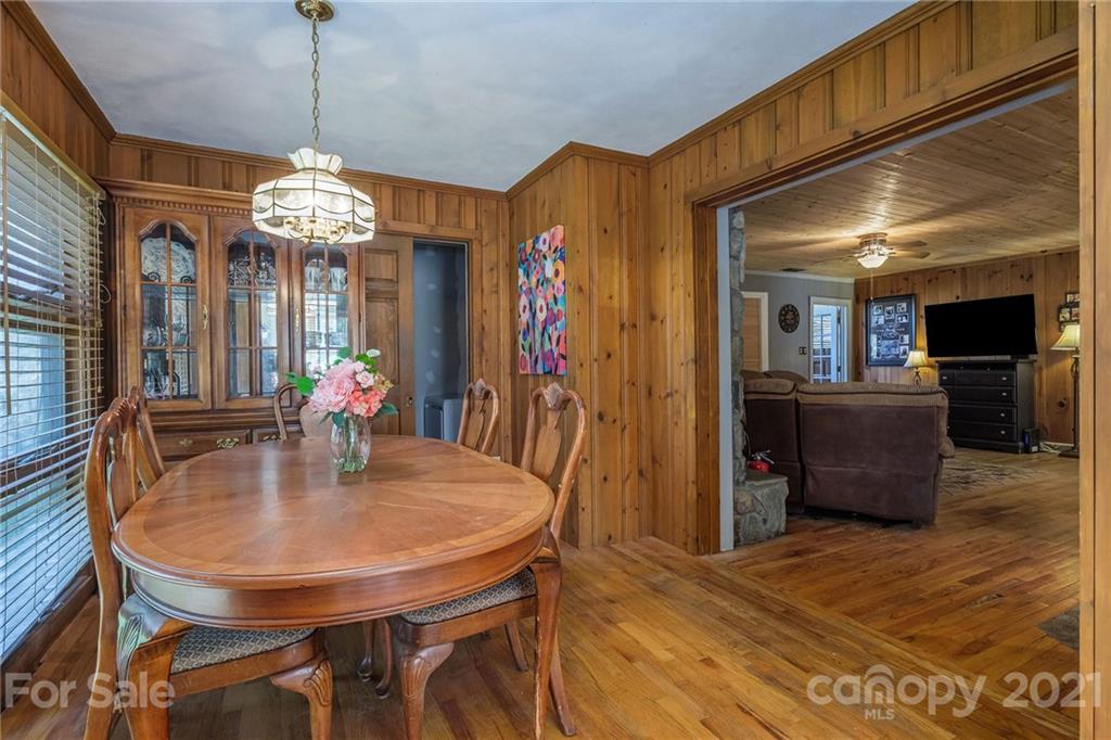 13914 Point Lookout Road Charlotte, NC 28278 - Photo 22 of 41 a view of a dining room with furniture window and wooden floor