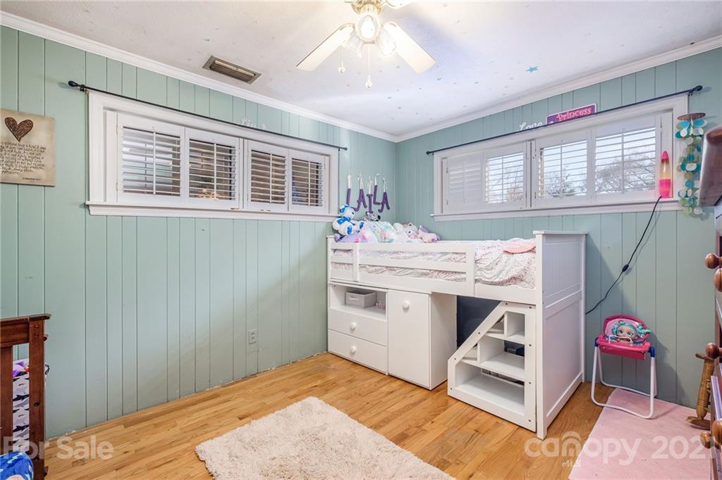 13914 Point Lookout Road Charlotte, NC 28278 - Photo 24 of 41 a room with a bed and a dresser