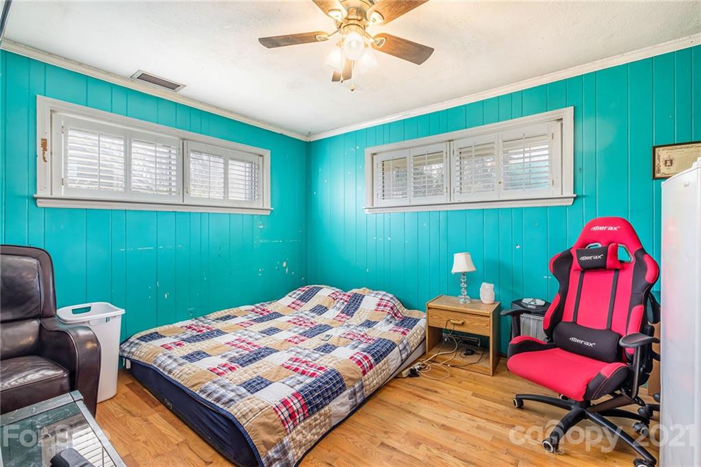 13914 Point Lookout Road Charlotte, NC 28278 - Photo 25 of 41 a bedroom with a bed and a workspace