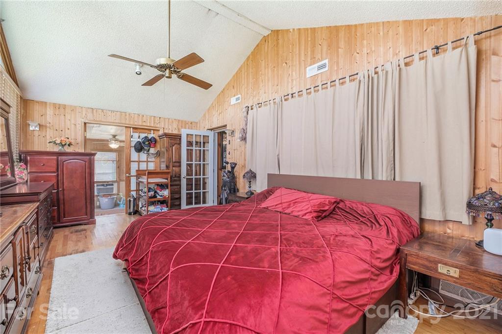 13914 Point Lookout Road Charlotte, NC 28278 - Photo 27 of 41 a bed sitting in a bedroom next to a window