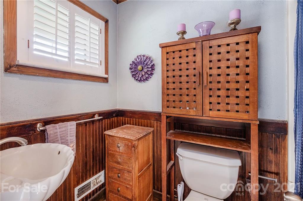 13914 Point Lookout Road Charlotte, NC 28278 - Photo 28 of 41 a bathroom with a sink a toilet and a window