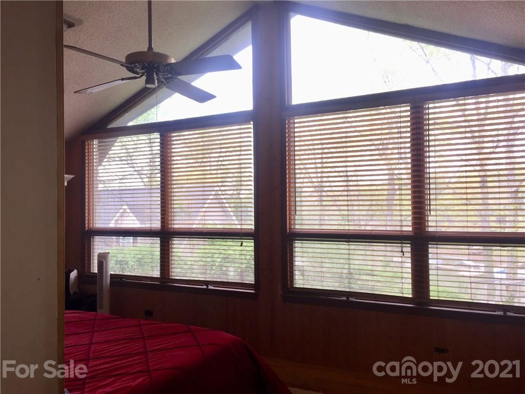13914 Point Lookout Road Charlotte, NC 28278 - Photo 30 of 41 a bedroom with a large window and a balcony
