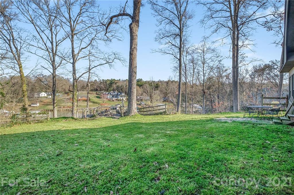13914 Point Lookout Road Charlotte, NC 28278 - Photo 37 of 41 a view of a yard with a tree