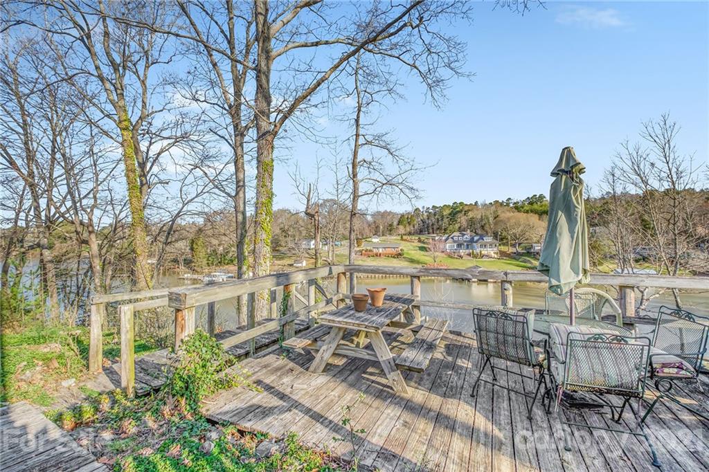 13914 Point Lookout Road Charlotte, NC 28278 - Photo 38 of 41 a view of lake with a table and chairs