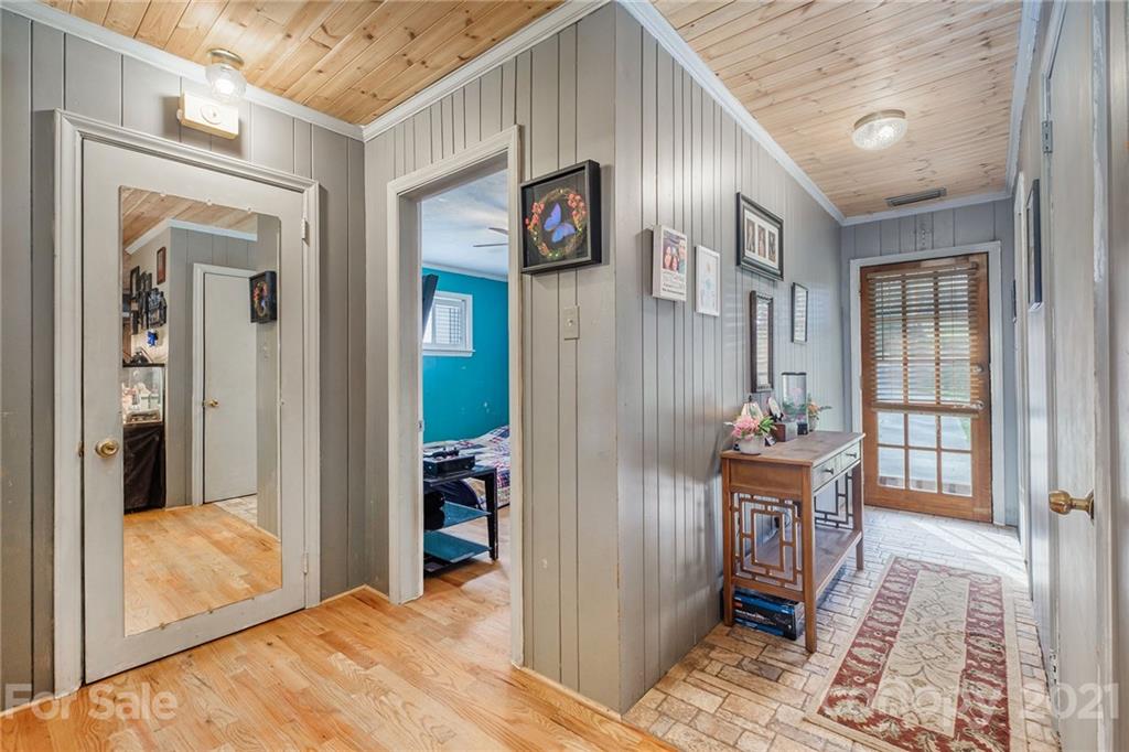 13914 Point Lookout Road Charlotte, NC 28278 - Photo 6 of 41 a very nice looking room with a large bed and wooden floor