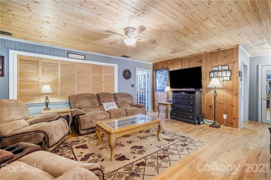 13914 Point Lookout Road Charlotte, NC 28278 - Photo 9 of 41 a living room with furniture and a flat screen tv