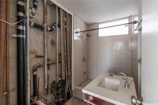 a bathroom with a tub and shower
