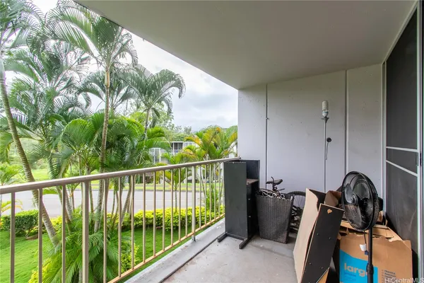 a view of a balcony with chairs