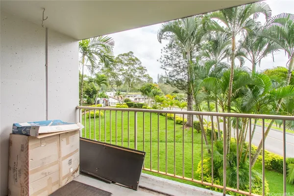 a view of balcony with furniture