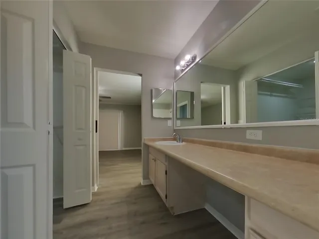 a spacious bathroom with a shower and a sink