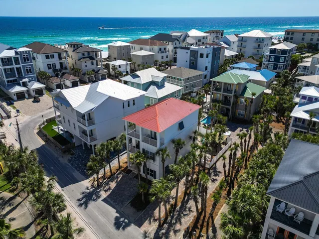 a living room with furniture a rug and a ceiling fan