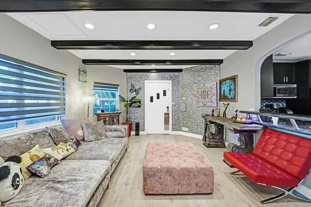 a view of a living room and kitchen