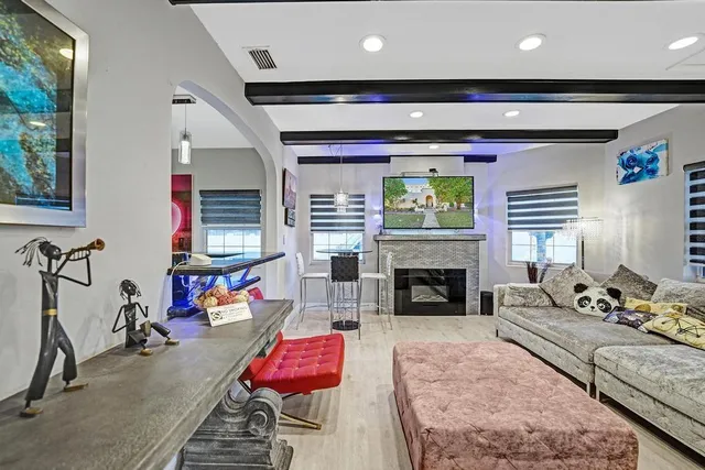 a kitchen with stainless steel appliances kitchen island granite countertop a table and chairs in it