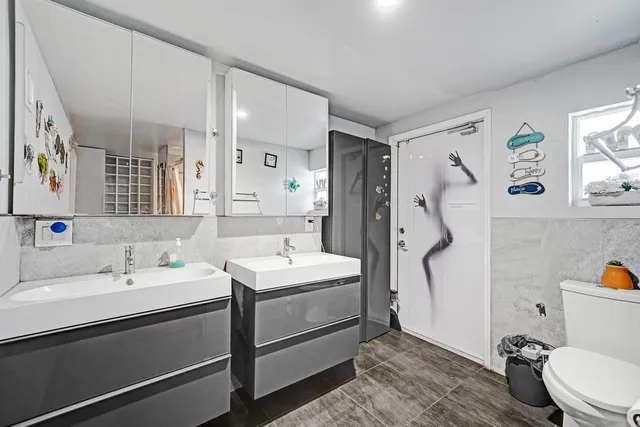 a view of a porch with a table and chairs