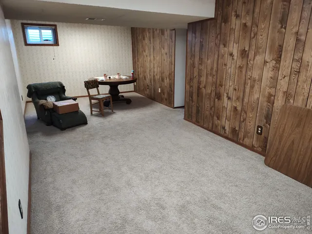 a living room with furniture and a chair