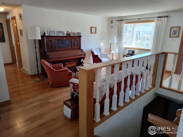 a view of an entryway with wooden floor