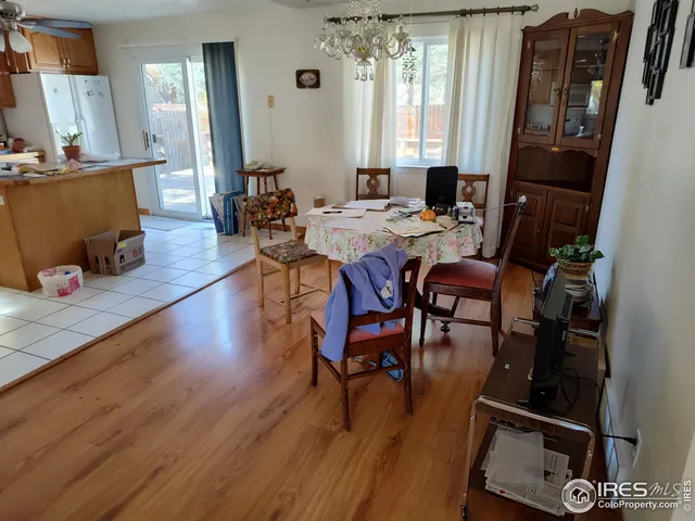 a view of a dining room with furniture and window