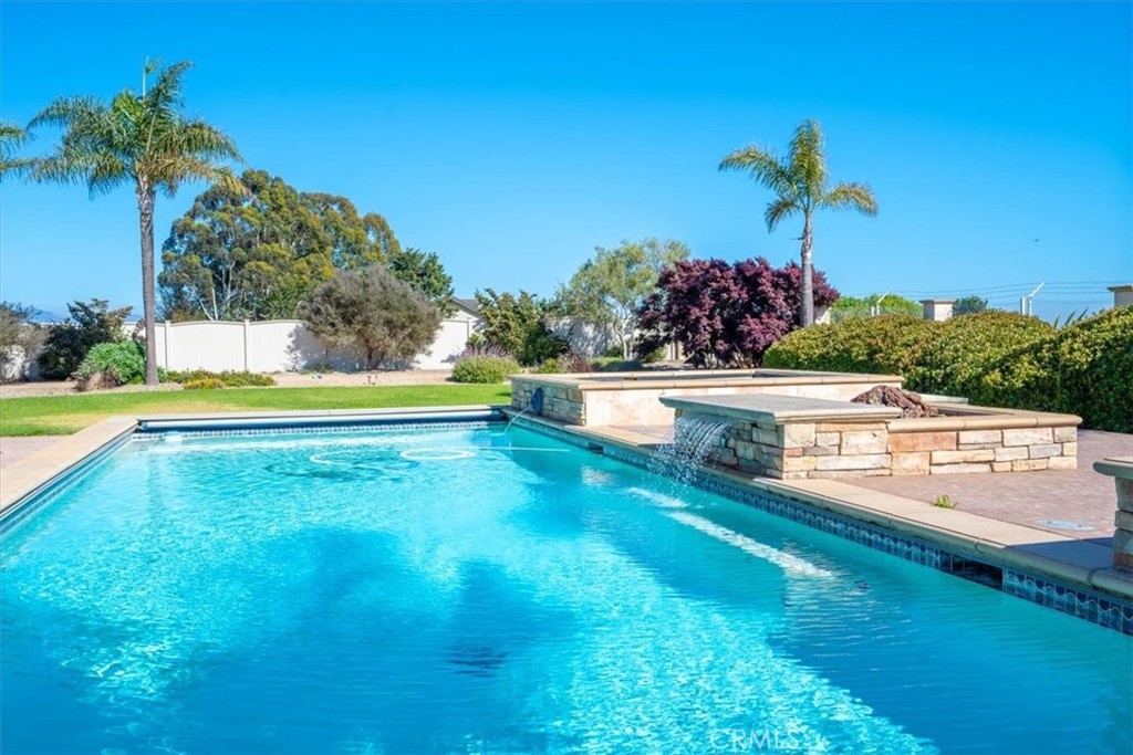 1685 Scenic View Way Nipomo, CA 93444 - Photo 23 of 64 a view of a swimming pool with an outdoor seating and a yard