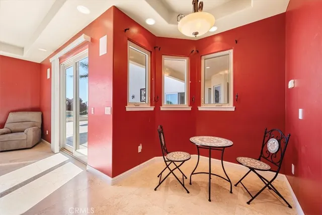 a spacious bathroom with a granite countertop double vanity sink a mirror and a bathtub