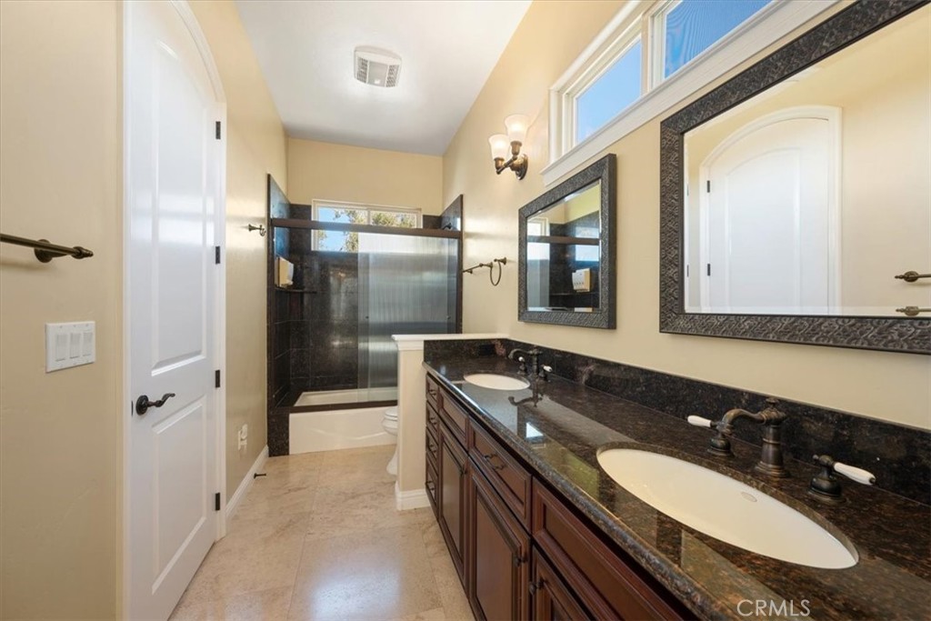 1685 Scenic View Way Nipomo, CA 93444 - Photo 34 of 64 a bathroom with a granite countertop double vanity sink and mirror