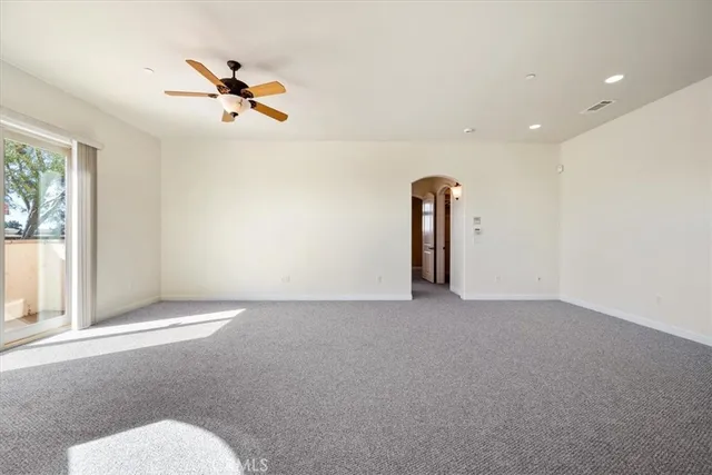 a kitchen with a stove a sink a refrigerator and cabinets