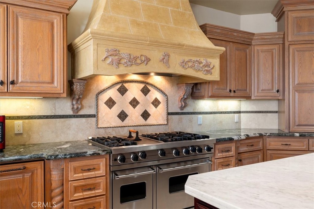 1685 Scenic View Way Nipomo, CA 93444 - Photo 50 of 64 a kitchen with stainless steel appliances granite countertop a stove and a sink