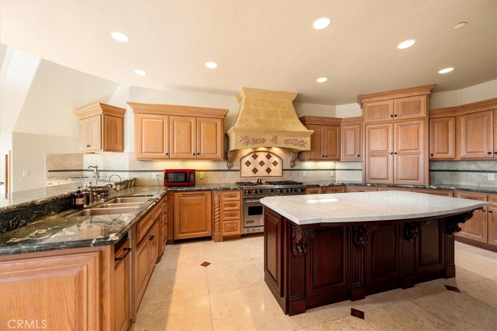 1685 Scenic View Way Nipomo, CA 93444 - Photo 52 of 64 a kitchen with a stove a sink a refrigerator and cabinets