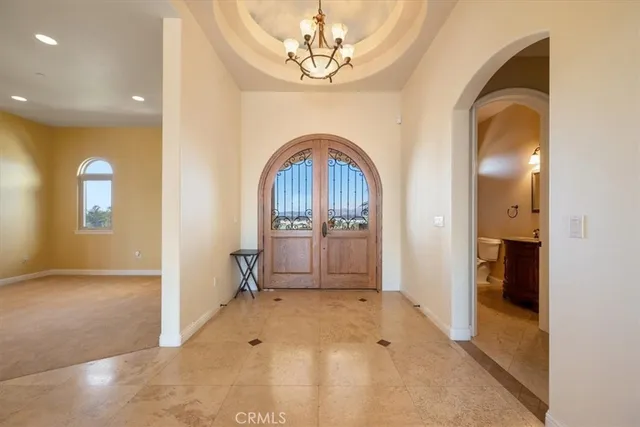 a view of a kitchen with a sink and cabinets