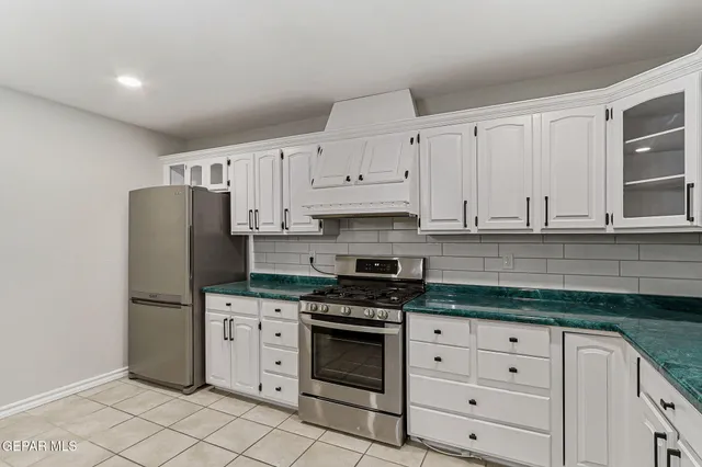 a bathroom with a sink and a large mirror