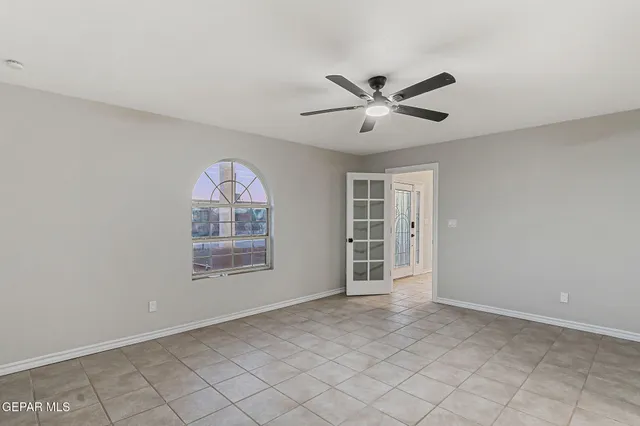 a bathroom with a granite countertop sink toilet a large mirror a vanity and shower