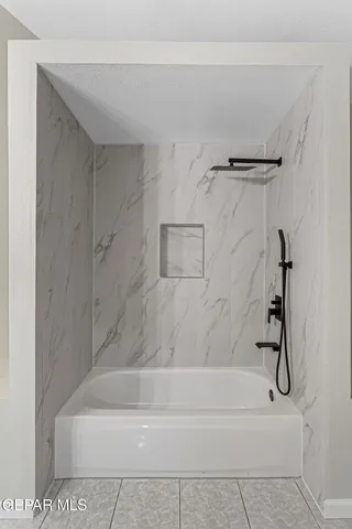 a bathroom with a sink vanity and a mirror