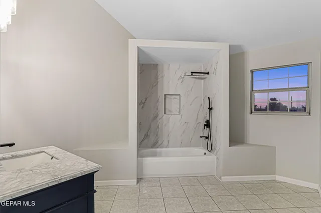 a view of a small space with wooden floor and a window
