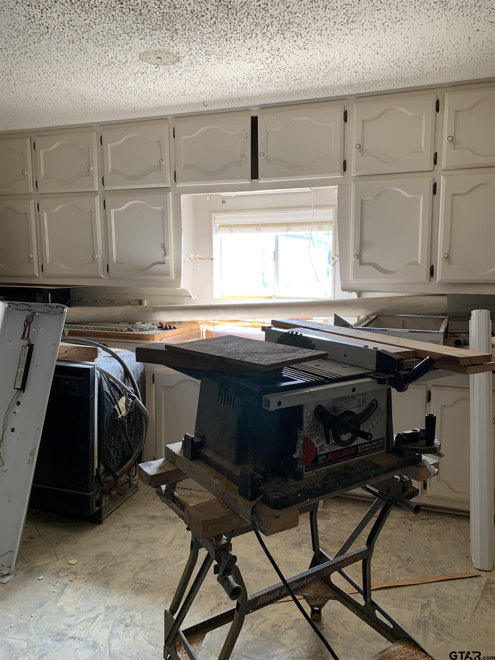 502 County Road 3264 Quitman, TX 75783 - Photo 22 of 37 a kitchen with a sink appliances and cabinets