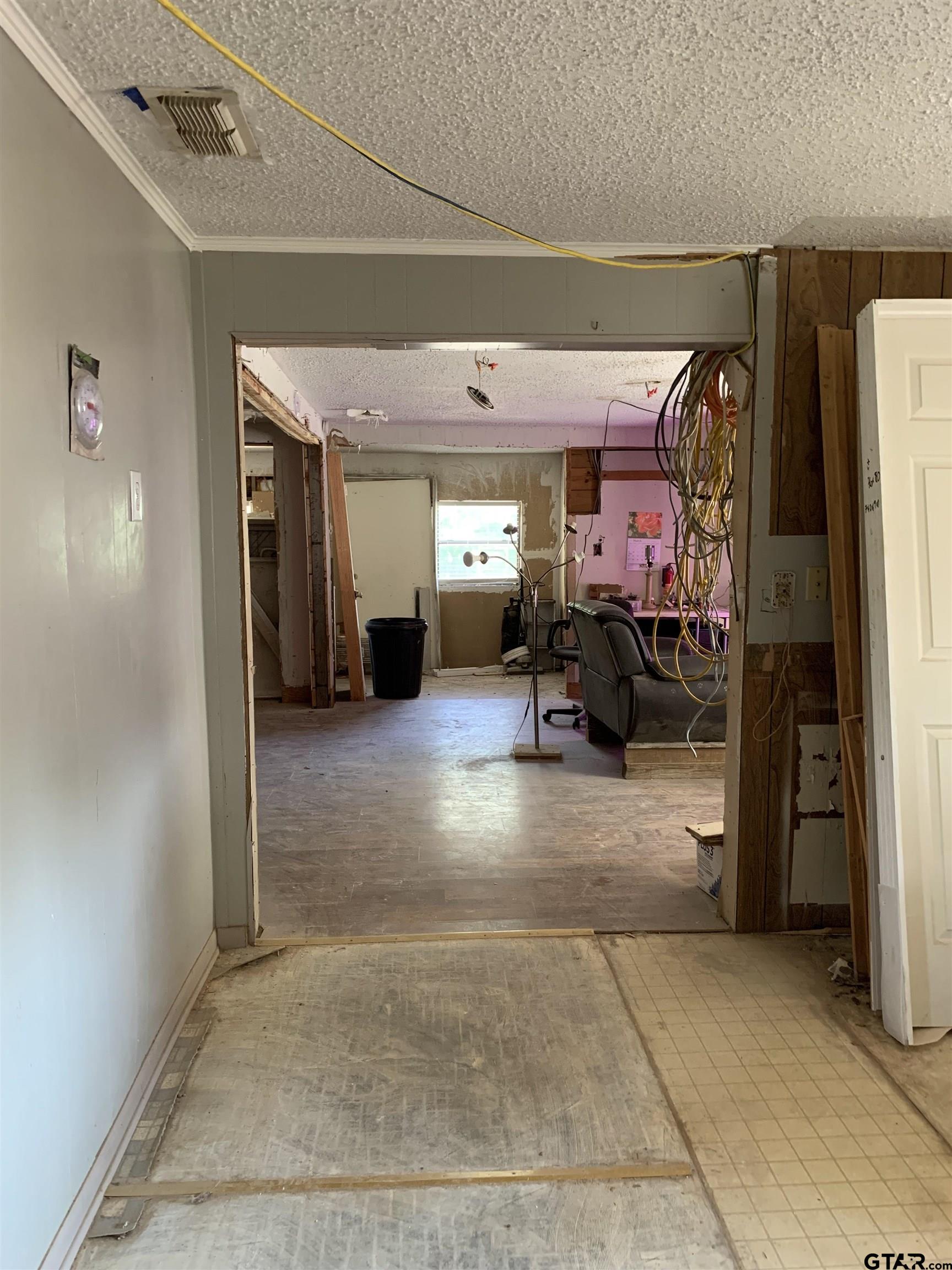 502 County Road 3264 Quitman, TX 75783 - Photo 23 of 37 a living room with furniture and a chandelier