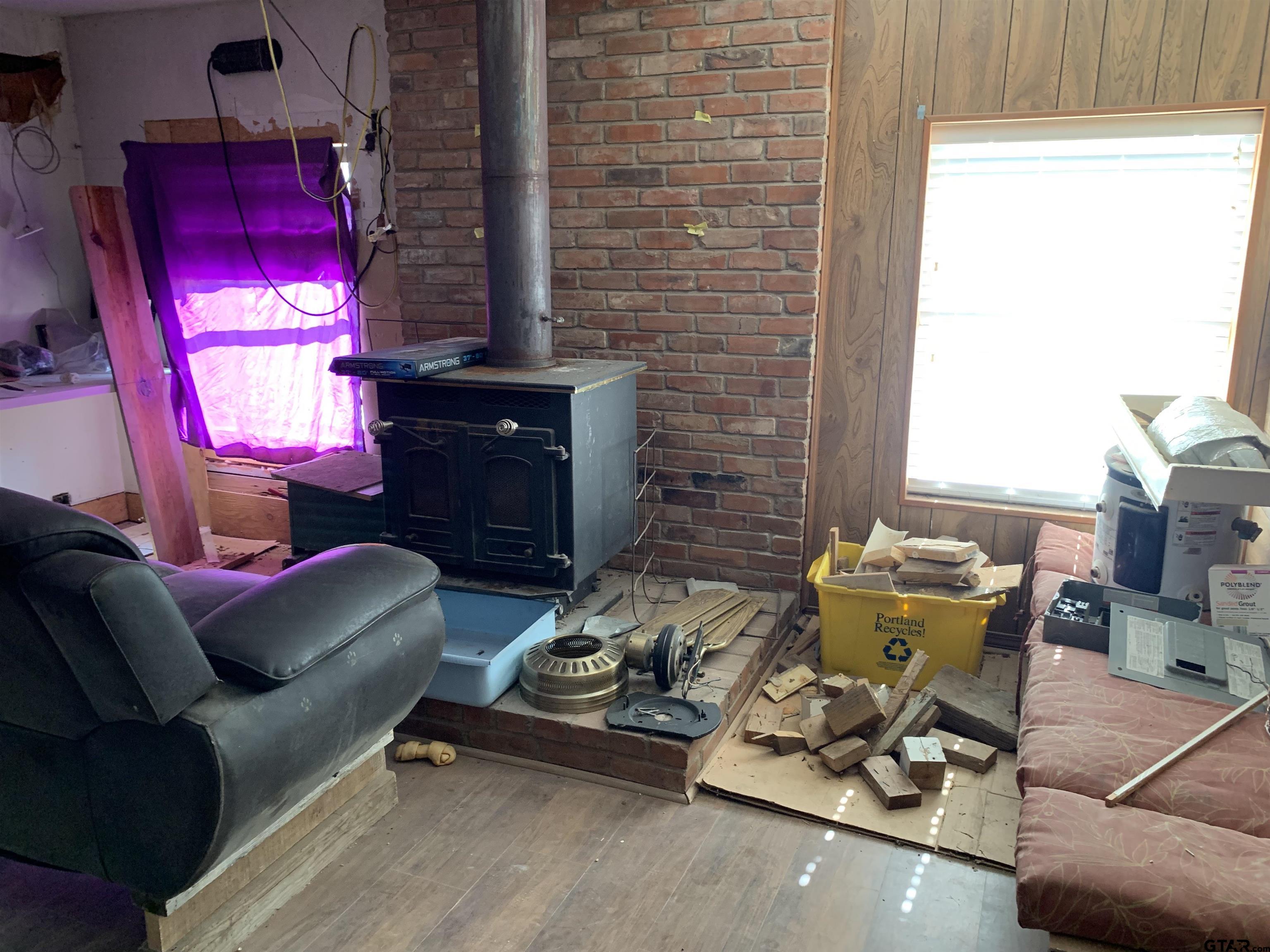 502 County Road 3264 Quitman, TX 75783 - Photo 24 of 37 a living room with furniture and a fireplace