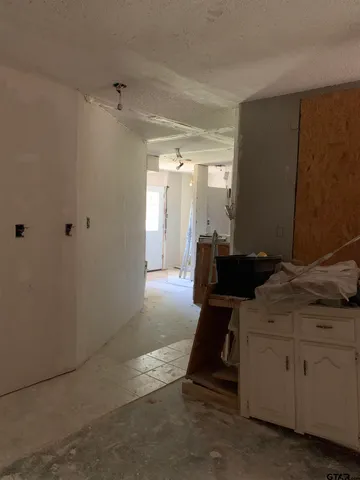 a room with gym equipment and a window