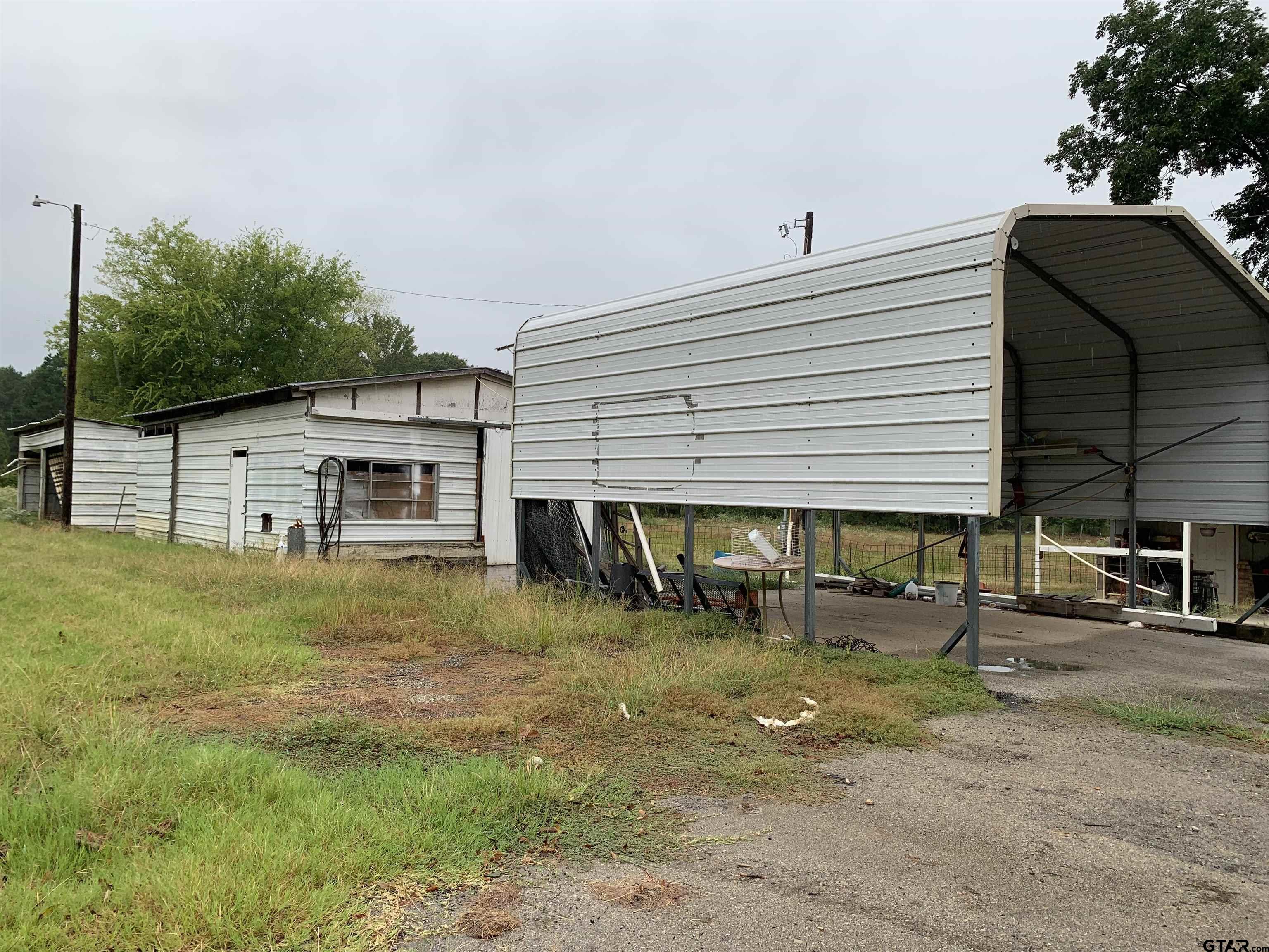 502 County Road 3264 Quitman, TX 75783 - Photo 4 of 37 a front view of a house with a yard