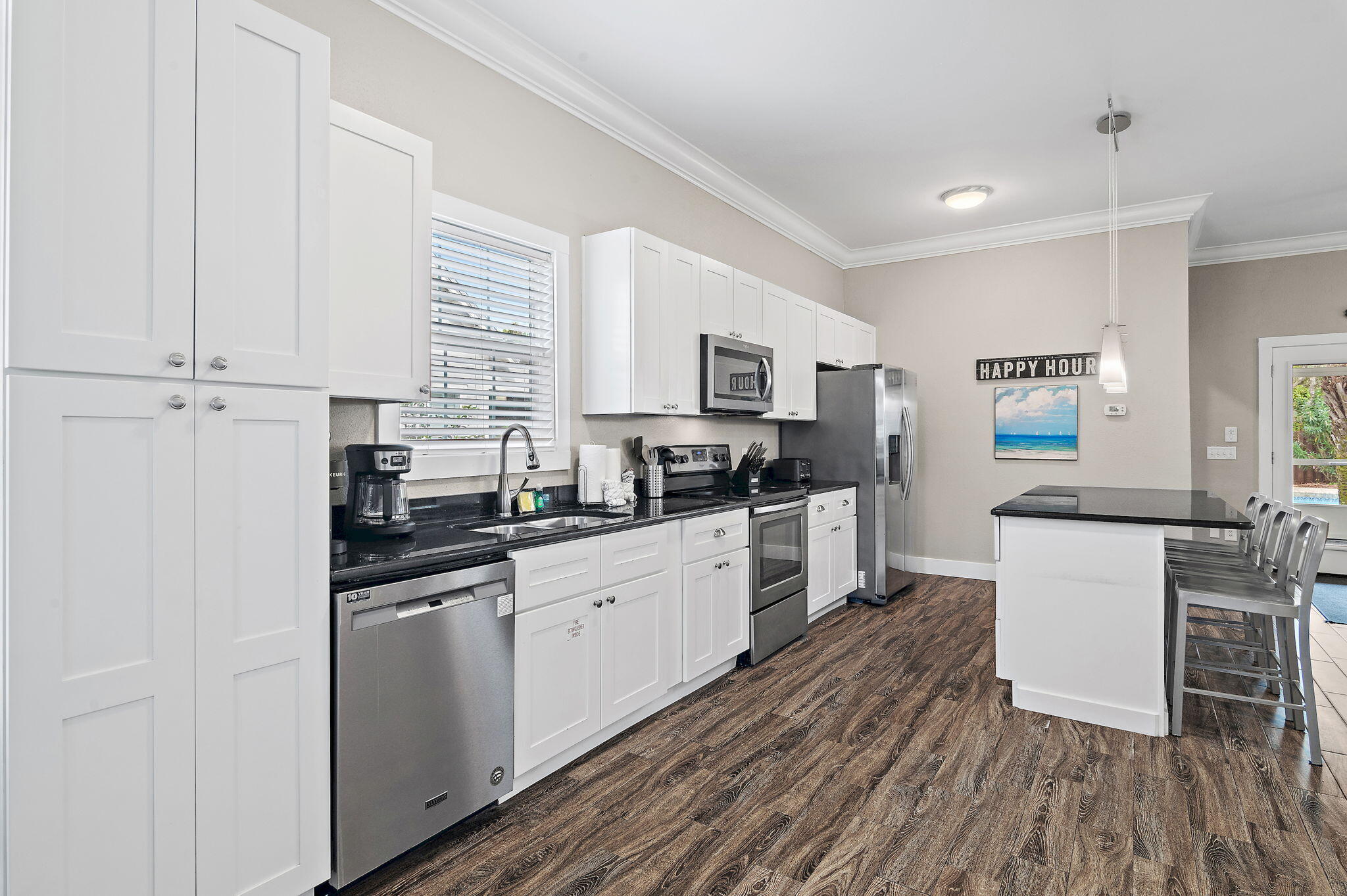 78 Pelican Glide Lane Inlet Beach, FL 32461 - Photo 14 of 61 a kitchen with granite countertop white cabinets and white appliances