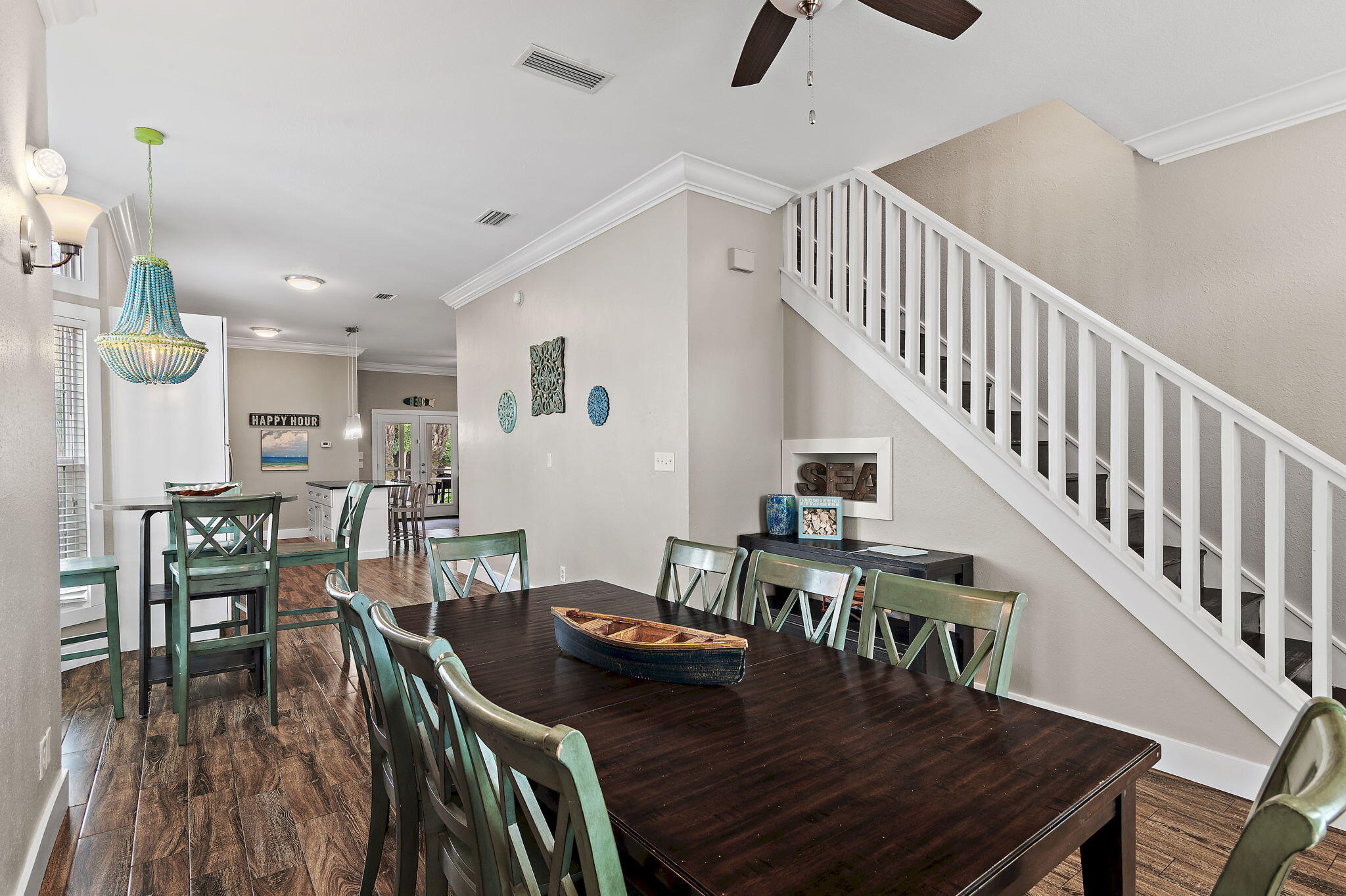 78 Pelican Glide Lane Inlet Beach, FL 32461 - Photo 18 of 61 a view of a dining room and livingroom with furniture wooden floor a chandelier