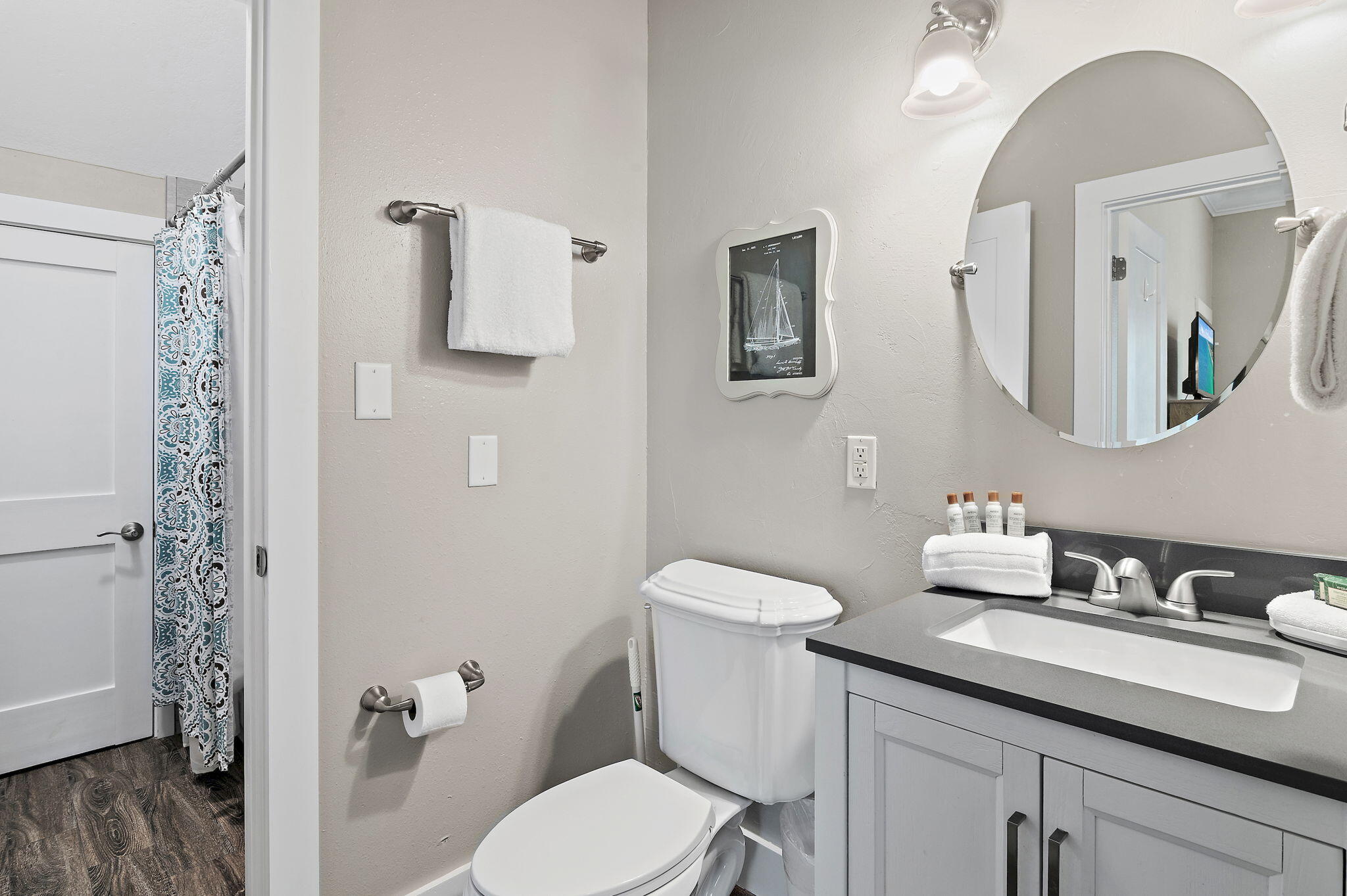 78 Pelican Glide Lane Inlet Beach, FL 32461 - Photo 23 of 53 a bathroom with a granite countertop toilet sink and mirror