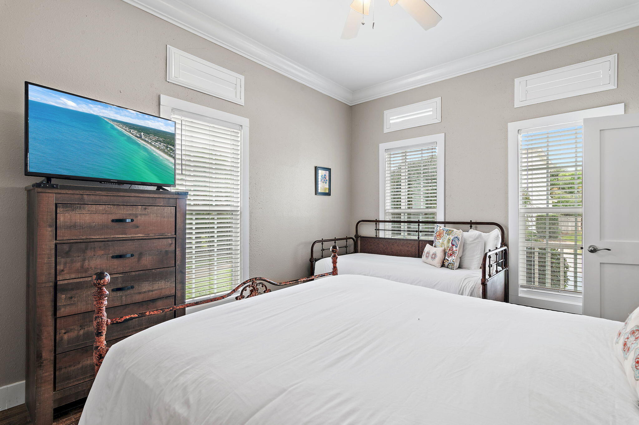 78 Pelican Glide Lane Inlet Beach, FL 32461 - Photo 26 of 61 a bedroom with a large bed and a flat tv screen