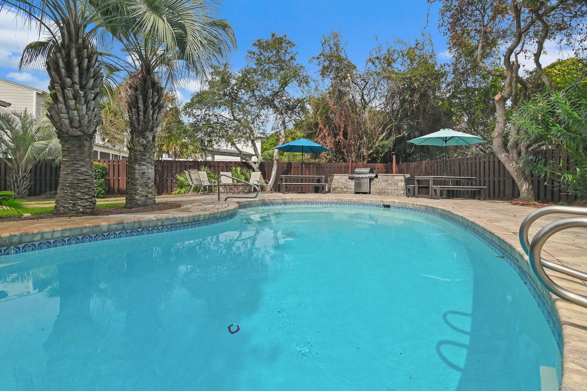 78 Pelican Glide Lane Inlet Beach, FL 32461 - Photo 44 of 53 a swimming pool with outdoor seating and yard