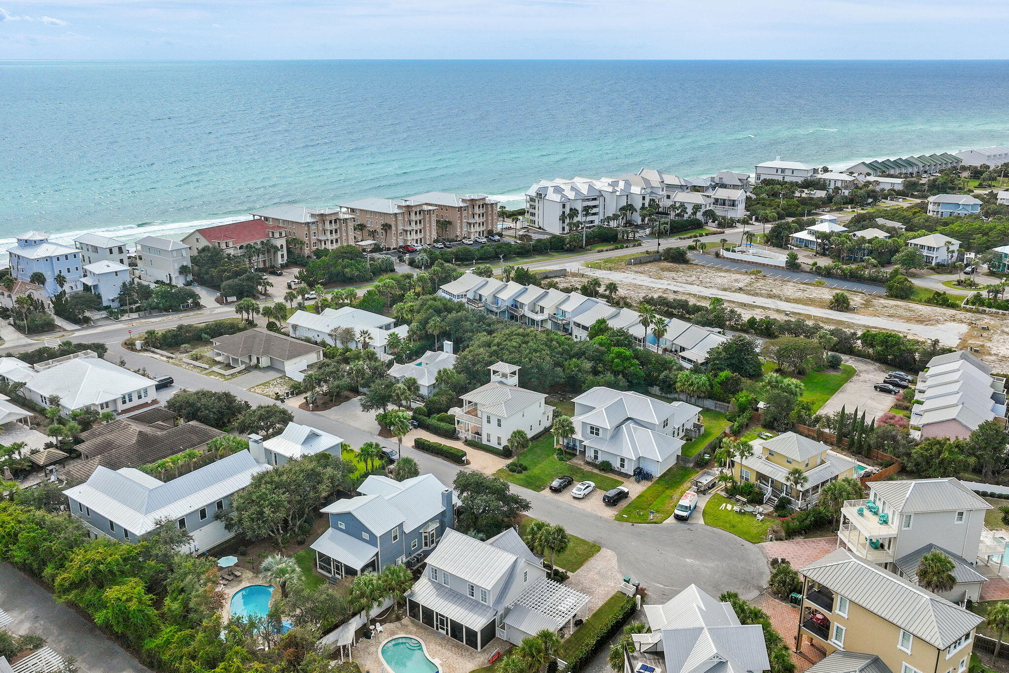 78 Pelican Glide Lane Inlet Beach, FL 32461 - Photo 45 of 53 an aerial view of a city with lots of residential buildings and ocean view in back