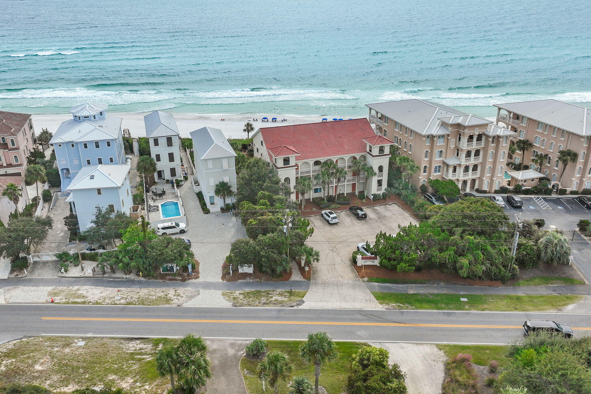 78 Pelican Glide Lane Inlet Beach, FL 32461 - Photo 49 of 53 a front view of a house with a yard and potted plants