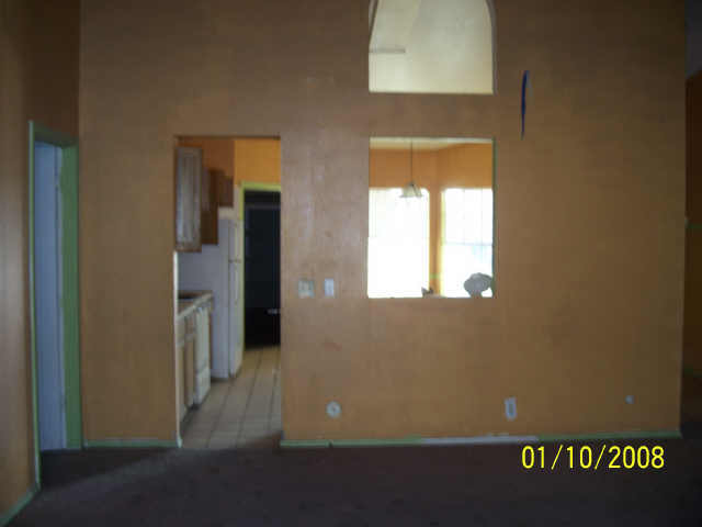 9018 West Granada Road Phoenix, AZ 85037 - Photo 2 of 2 a view of a hallway with wooden floor and a bathroom