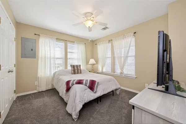 a bed room with a bed and a window